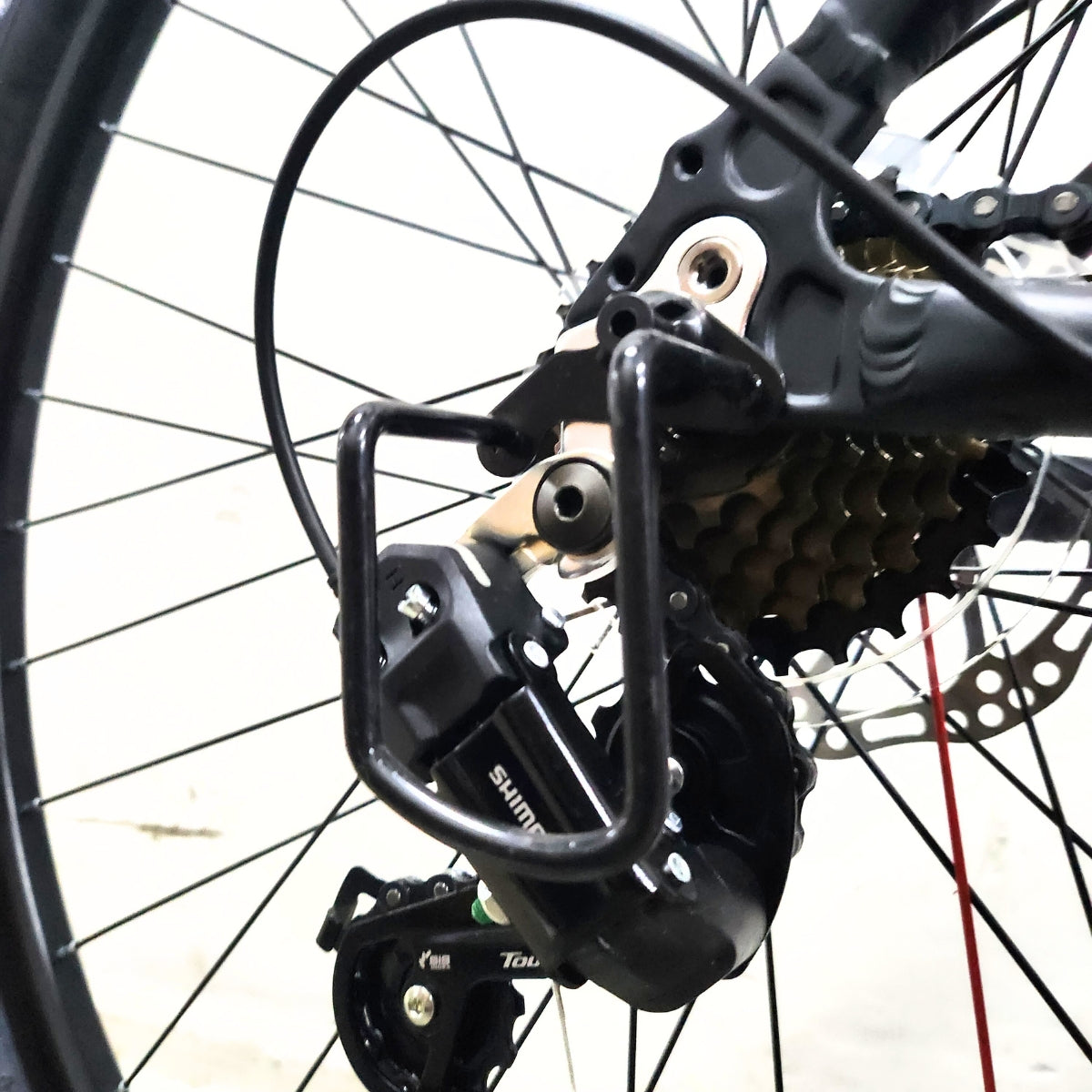 Protector de descarrilador trasero